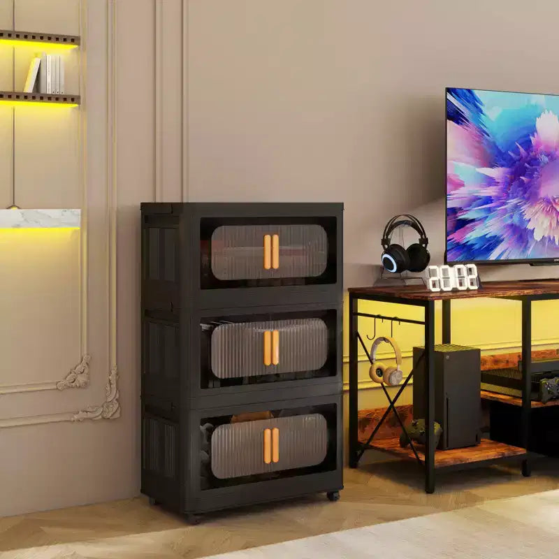 Meuble de rangement pliant noir à 3 niveaux en plastique avec porte magnétique et roulettes – 1 personne