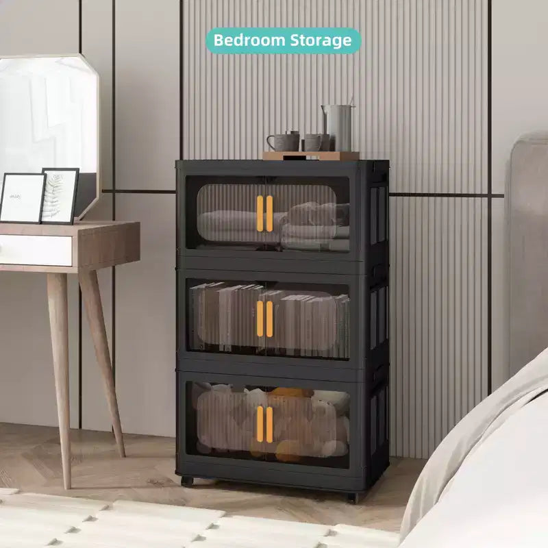 Meuble de rangement pliant noir à 3 niveaux en plastique avec porte magnétique et roulettes – 1 personne